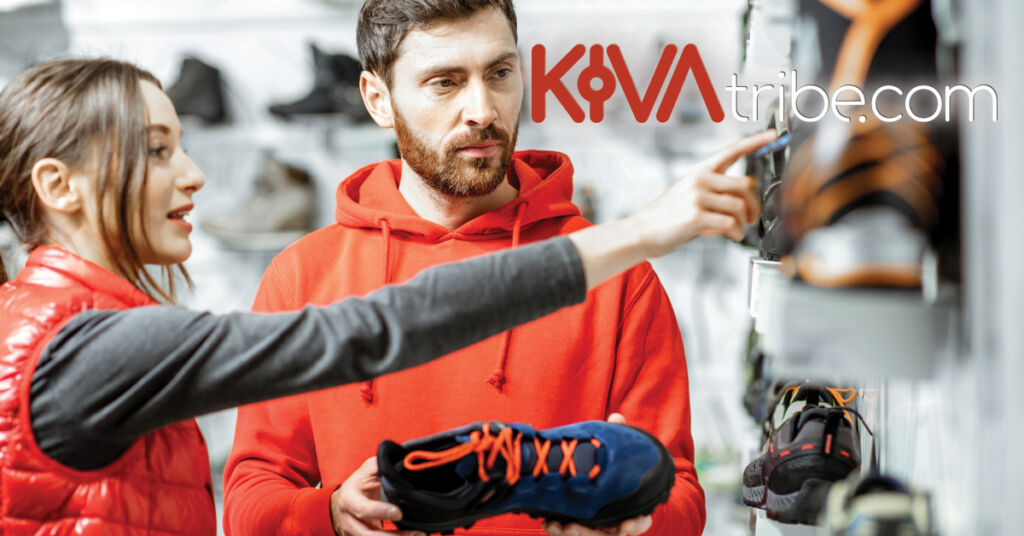 KivaTribe_Barefoot_Shoe_Checklists_1200X628px a couple in a shoe shop discussing the shoes
