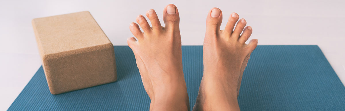 bare feet on an exercise mat
