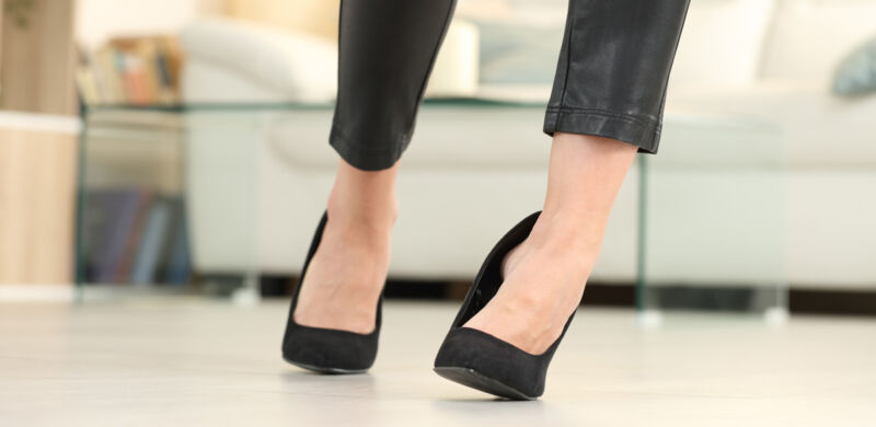 woman in high heels just about to twist her ankle